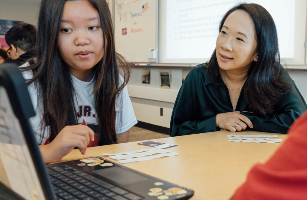 Chan Zuckerberg Initiative Commits Funding To Help Educators Shape How AI Will Be Used in Classrooms CZI’s Head of Education, Sandra Liu Huang, observes students using an AI tool.